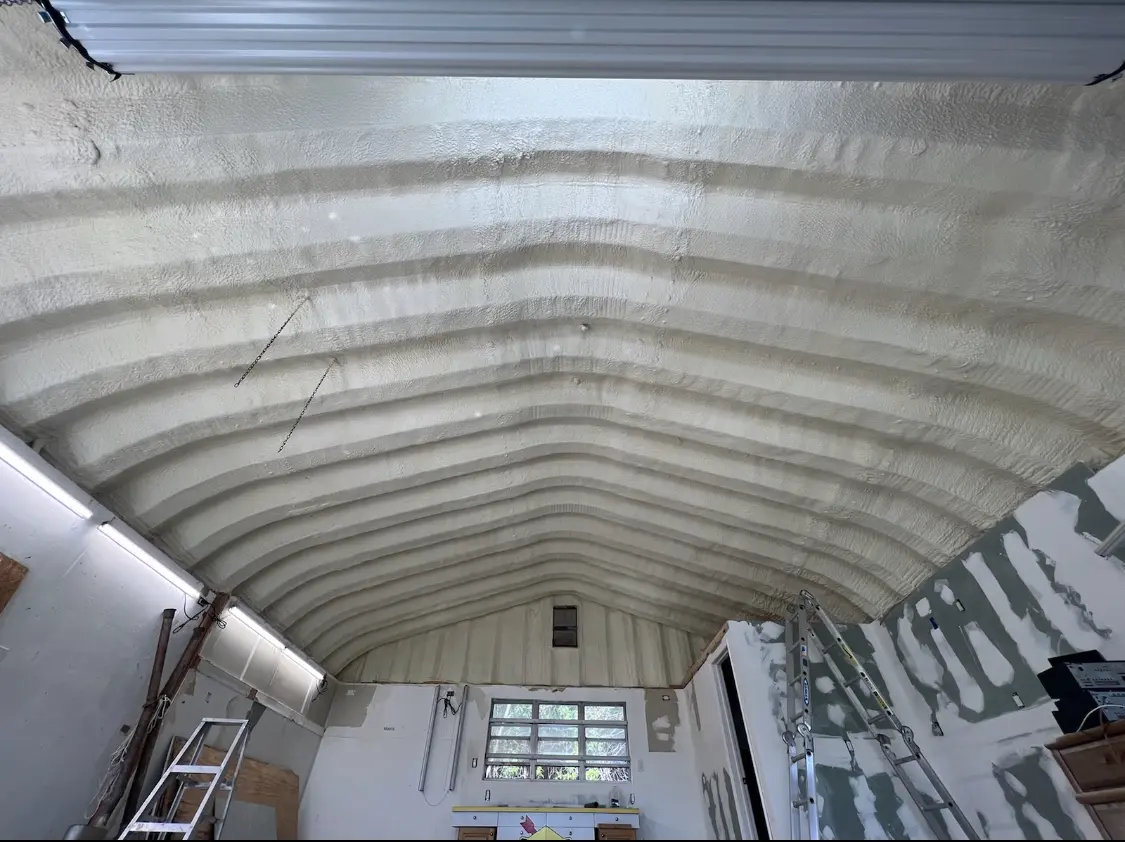 Spray polyurethane foam applied to the underside of a metal roof deck in Lincoln Park